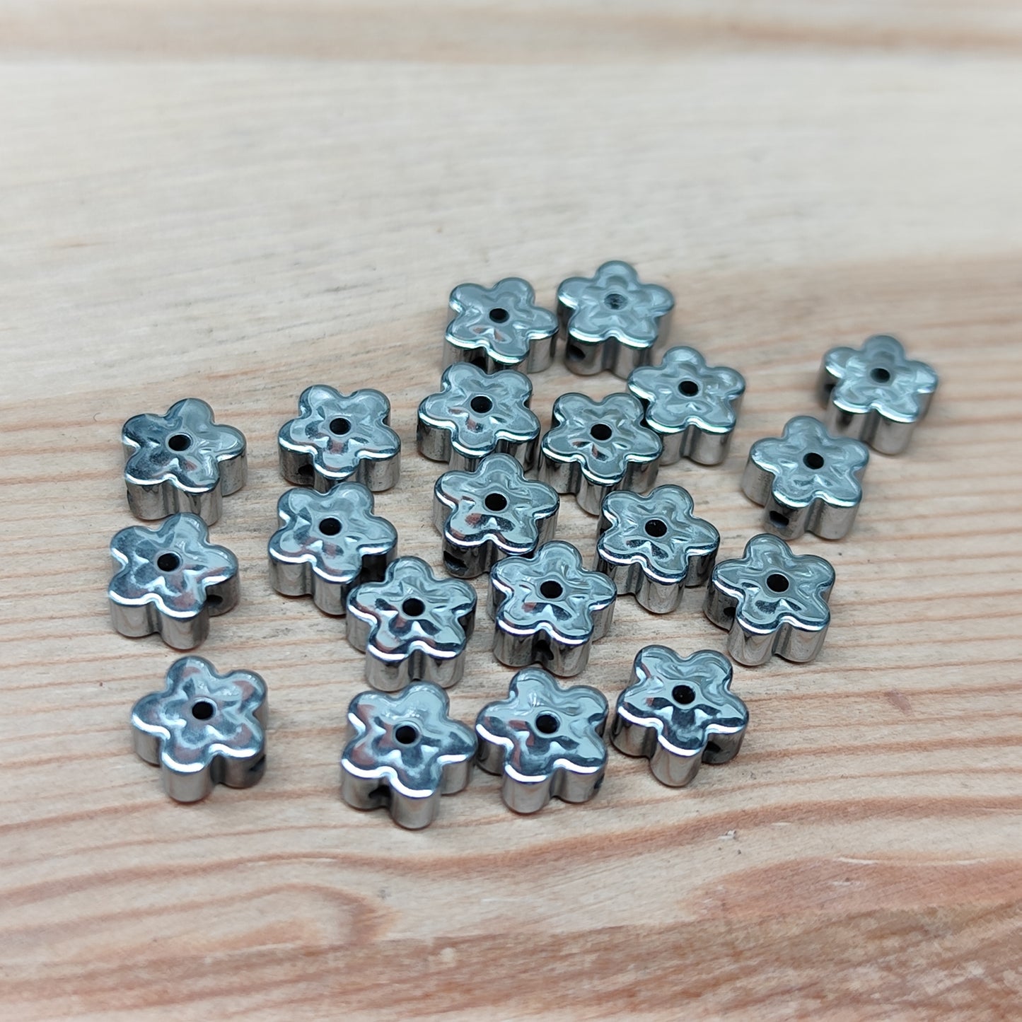 Hématite fleur argenté – 5,5 mm – lot de 20