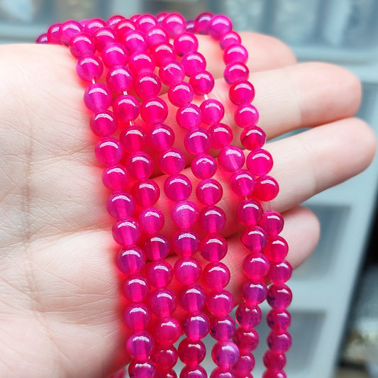 Perles Opalite rose fuchsia – perles synthétiques 6,5 mm - 1 fil entier